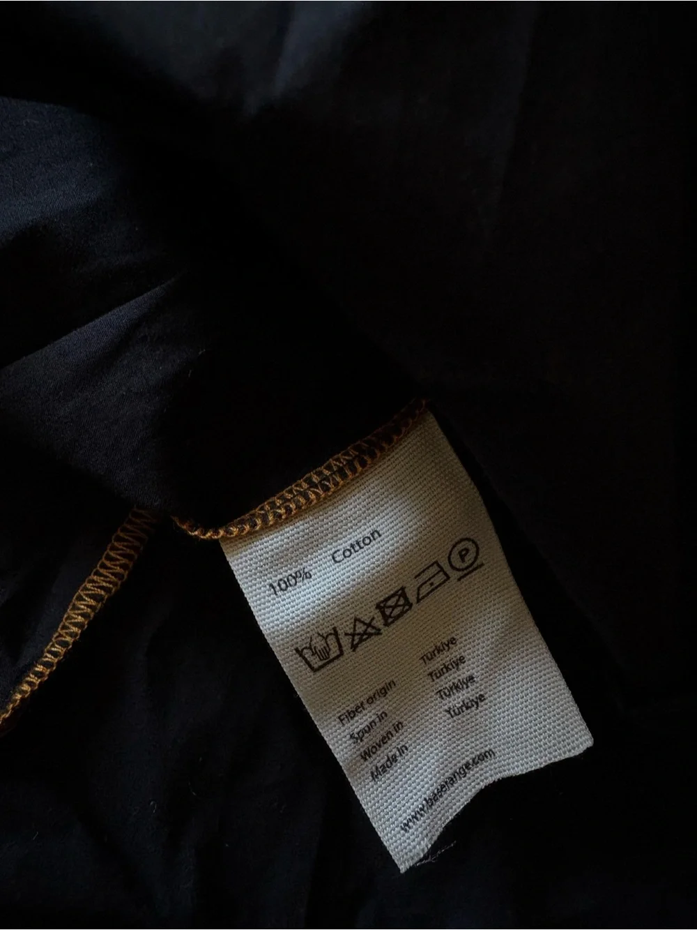 BASERANGE The Turn Skirt In Black Organic Cotton Contrast Stitch Twisted Seams
